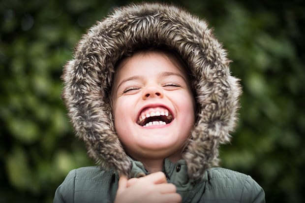 Girl with Big Smile Wearing Parka